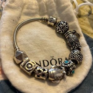 Authentic pandora bracelet with 11 charms.